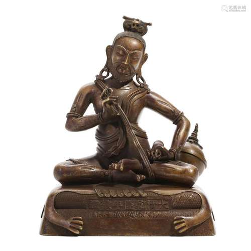 A BRONZE BUDDHA FIGURE