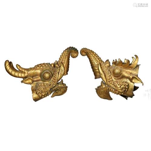 A PAIR OF GILT-BRONZE DRAGON HEADS