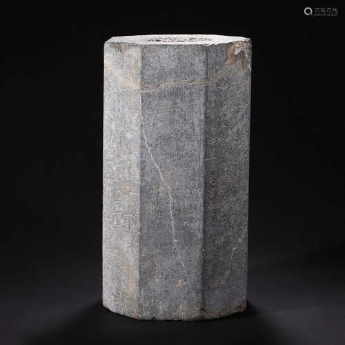 A HEXAGONAL STONE PILLAR