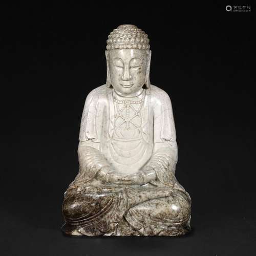 A WHITE JADE FIGURE OF SEATED SHAKYAMUNI