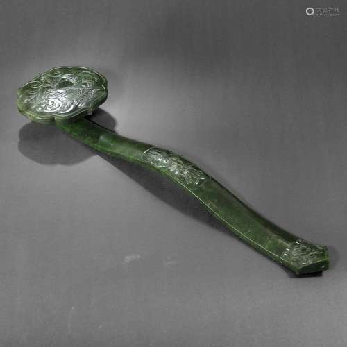 A SPINACH-GREEN JADE RUYI SCEPTRE