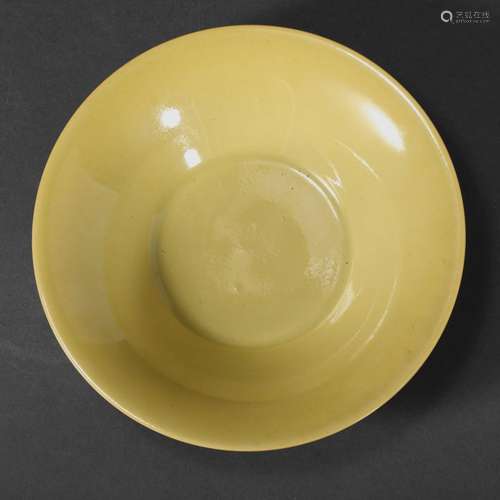 A YELLOW-GLAZED BOWL