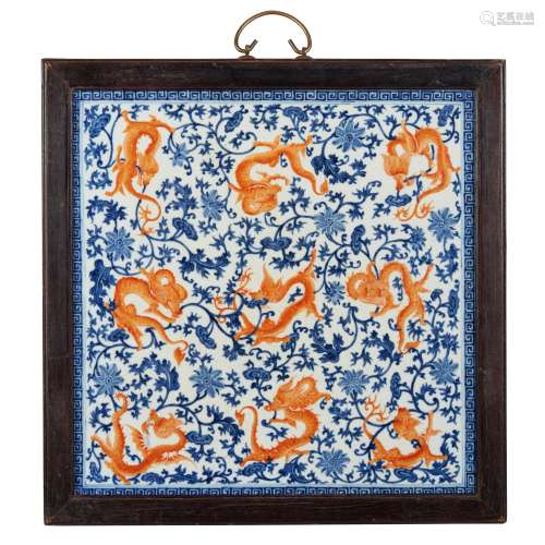 BLUE AND WHITE WITH IRON-RED DECORATED 'NINE DRAGONS' PLAQUE...