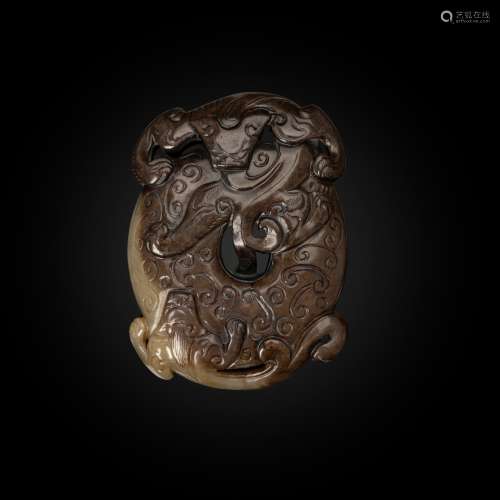 CELADON AND BROWN JADE 'DRAGON' DISC-FORM PENDANT MING DYNAS...