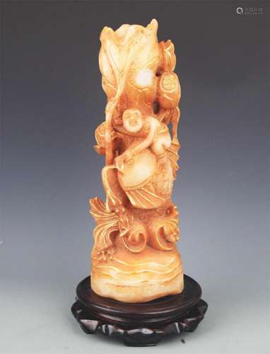 A LARGE FINE JADE MADE BOY WITH FISH DECORATION