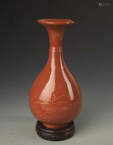 A DING KILN STYLE LOTUS CARVING YU HU CHUN VASE