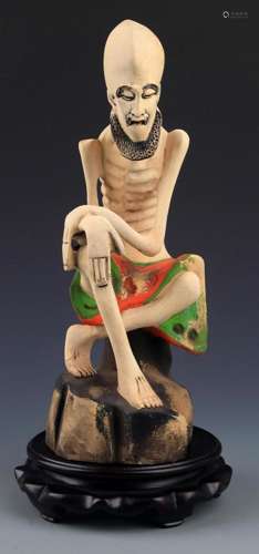 A COLORED WOODEN BODHIDHARMA FIGURE