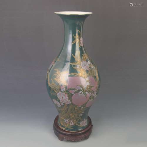 A DARK GREEN GLAZED PEACH PATTERN GUAN YIN VASE