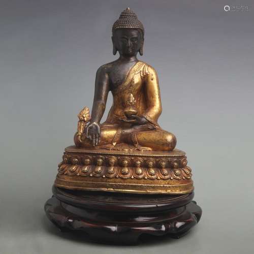 A FINE GILT BRONZE BHAISAJYAGURU BUDDHA