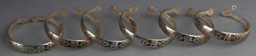 GROUP OF FINELY CARVED SILVER PLATED BANGLES