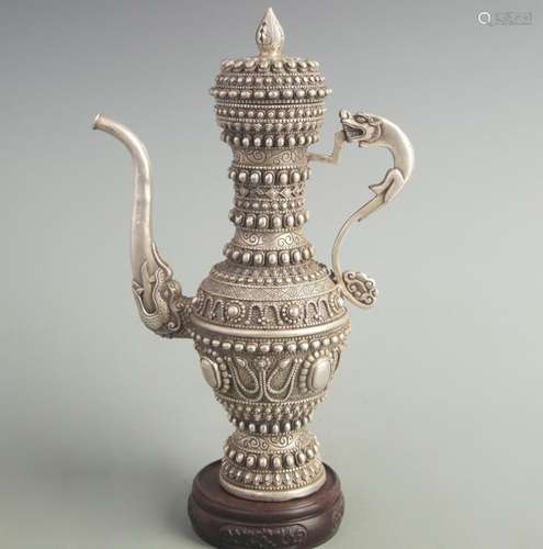 A FINE WHITE BRONZE FINELY CARVED EWER