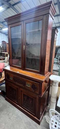 A late Victorian carved walnut secretaire bookcase, width 12...