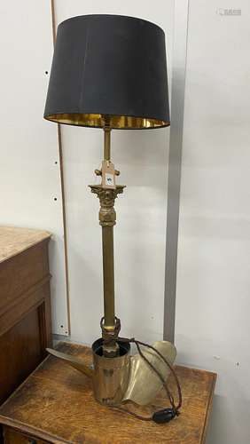 A brass Corinthian column standard lamp with ship propeller ...