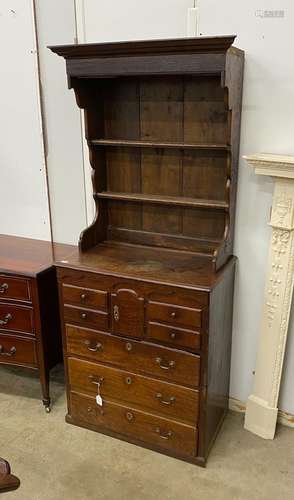 An 18th century oak chest of drawers with later associated o...