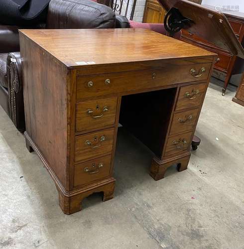 A George III mahogany kneehole desk, width ,depth 65cm, heig...