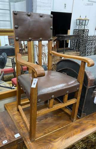 A pair of Arts & Crafts oak elbow chairs, width 58cm, de...