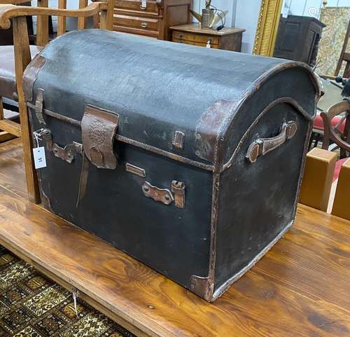 A Victorian leather dome top trunk with original interior by...