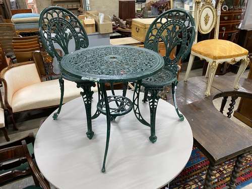 A Victorian style aluminium garden table, diameter 60cm, hei...