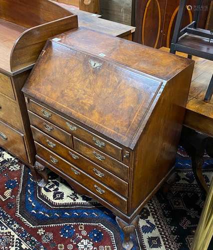 A Queen Anne revival feather banded walnut bureau, width 76c...