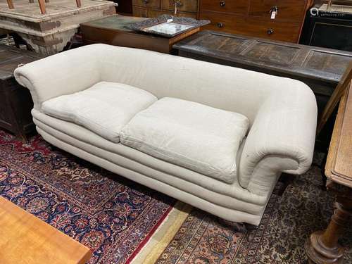 A late Victorian Howard style Chesterfield settee upholstere...