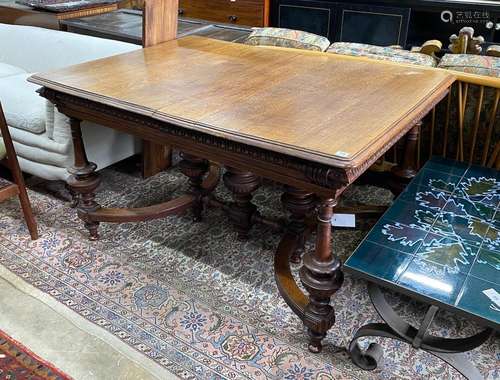 A late 19th / early 20th century French oak extending dining...