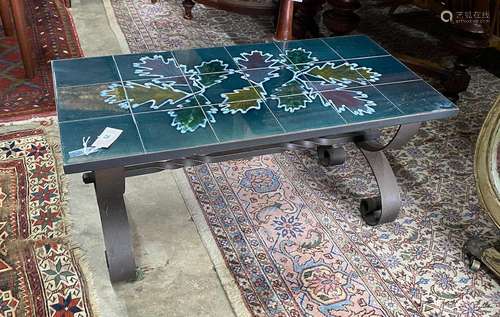 A 1970s wrought iron tile top coffee table, length 90cm, dep...