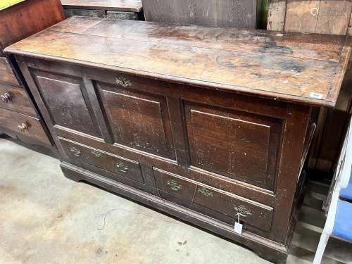 A mid 18th century oak mule chest with squared triple panell...
