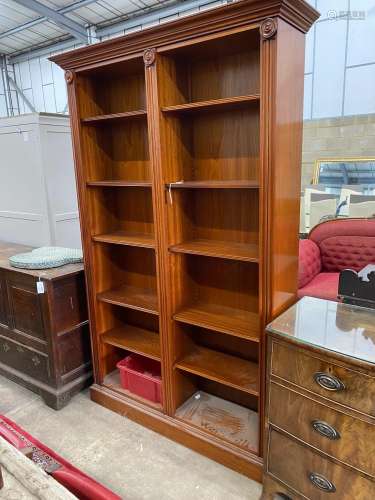 A Victorian style mahogany open bookcase, width 138cm, depth...