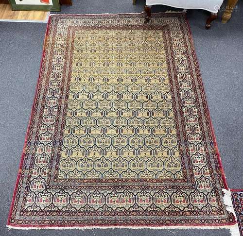 An antique North West Persian faded peach ground rug, 200 x ...