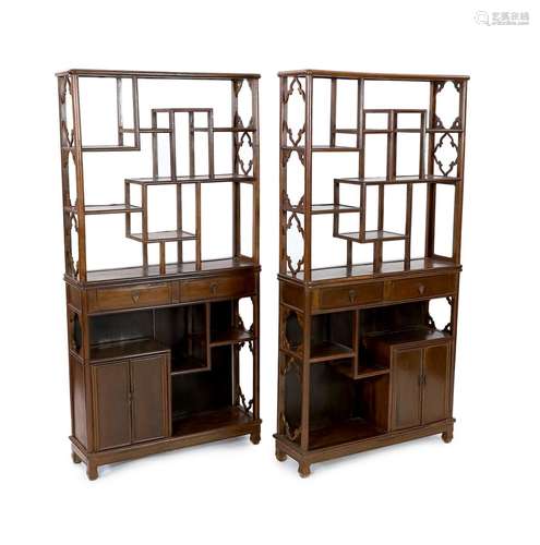 A pair of Chinese jichimu display cabinets, each with asymme...