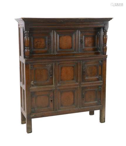 A mid 18th century oak cupboard, with moulded cornice and th...