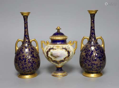 A pair of Royal Worcester bottle vases and a Coalport landsc...