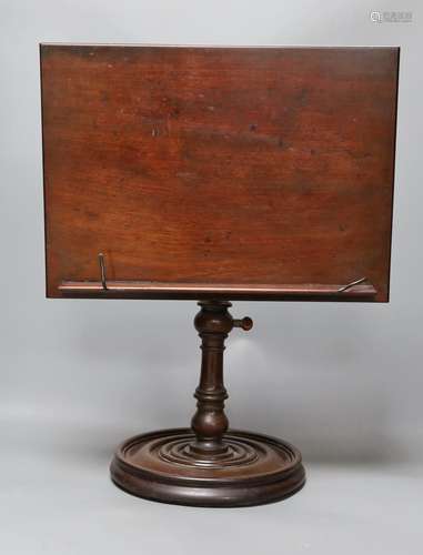 A 19th century turned mahogany book/ music stand,49 cms high...