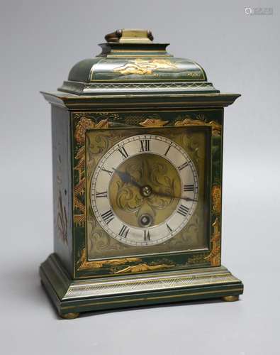 A 1920s green japanned mantel timepiece,26 cms high,