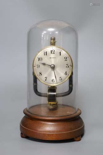 A Bulle electric clock under a glass dome,28 cms high,