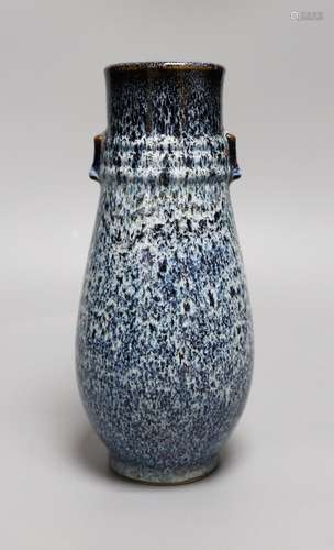 A Chinese Shiwan vase, 23 cms high,