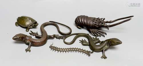 A group of bronze figures of two lizards, a centipede, a tor...