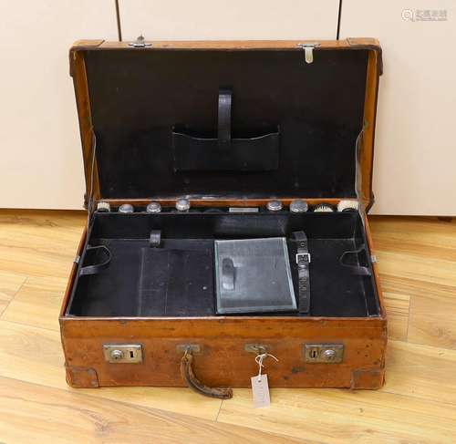 A Dupont travel suitcase, initialled ‘L.C.’ with French whit...