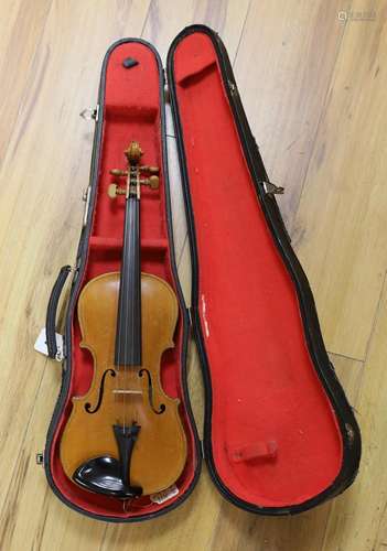 A cased students violin, length of back 33 cm