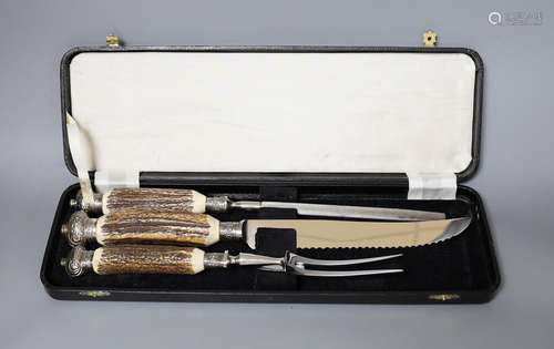 A Greenwood and Sons stag antler handled carving set, in ori...