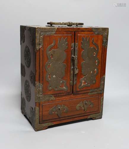 A Chinese brass mounted two door, five drawer cabinet,29 cms...