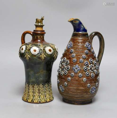 A Doulton Lambeth stoneware decanter and a similar jug, date...