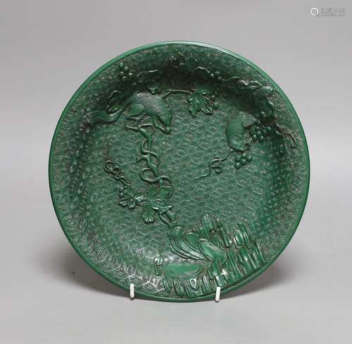 A Chinese green lacquer dish, 24.5cms diameter,