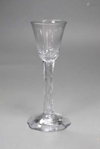 An 18th century facet stemmed glass with a petal foot,16.5 c...