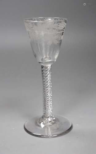 An 18th century engraved air twist stem wine glass, 15cm tal...