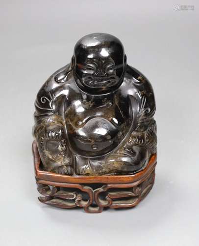 A large Chinese smoky quartz figure of Budai, 17cm tall incl...