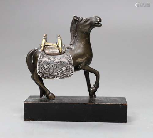 A Chinese bronze mixed metal figure a saddled horse, late 19...