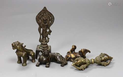 Five Chinese or Tibetan bronze figures or Buddhist implement...