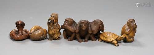 Five wooden animal netsuke; koi, cobra, monkey, tortoise, he...