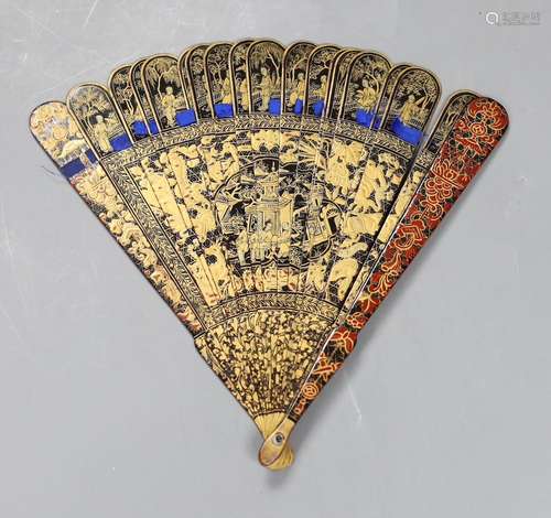 A Chinese gilt-decorated lacquer fan in a brocade covered ca...